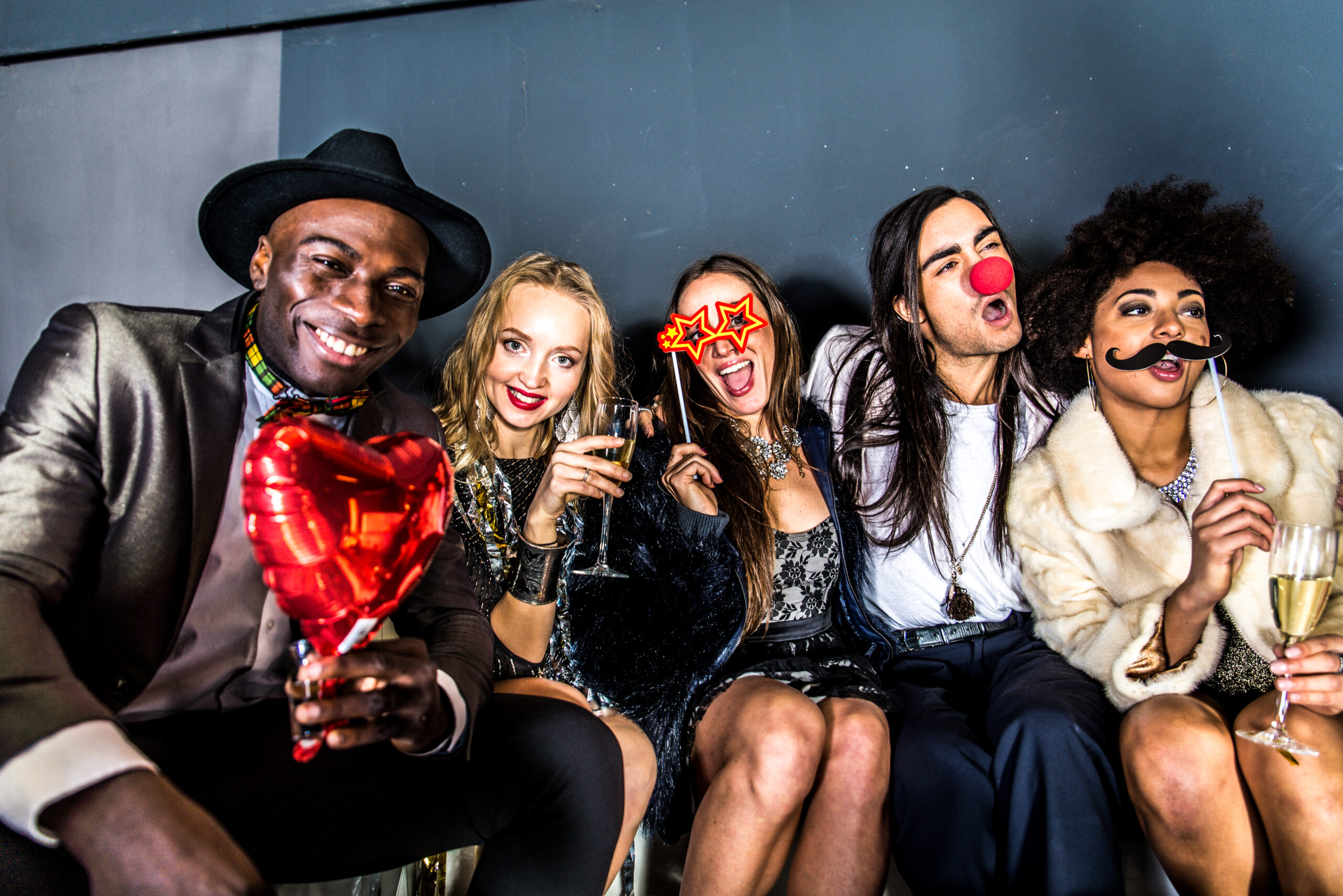 Multi-ethnic group of friends celebrating in a nightclub - Clubbers having party